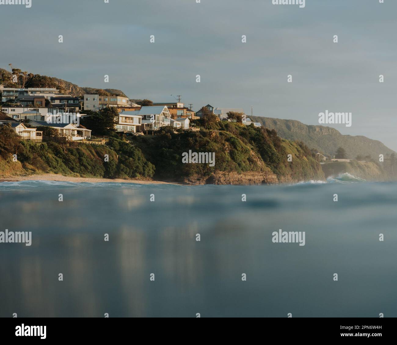 Coastline viewing from the silky smooth ocean Stock Photo