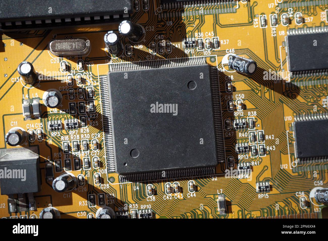 Electronic circuit board with processor. Blank surface chip. Stock Photo