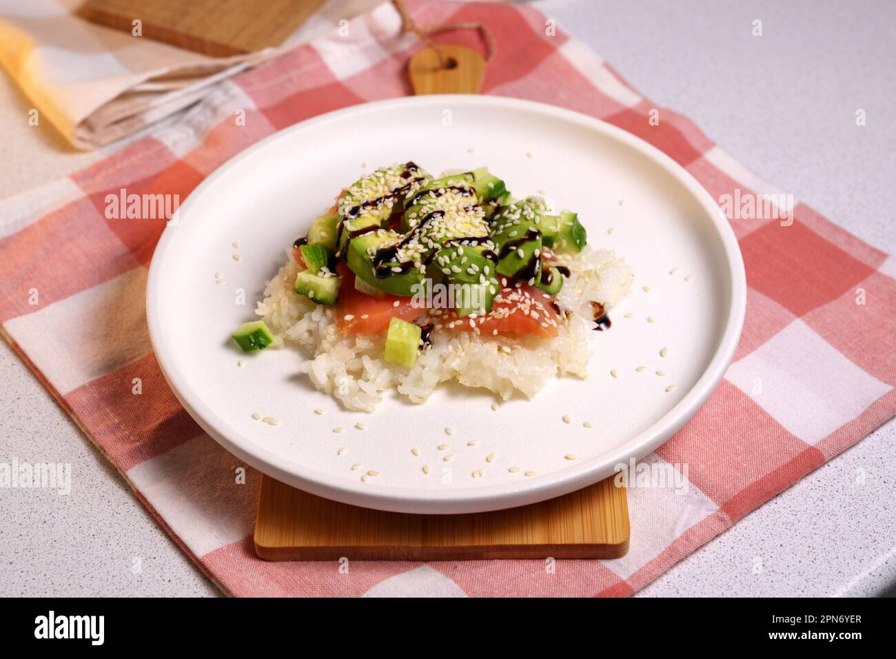Sushi Waffle is crispy rice, made in a waffle maker, topped with shoyu