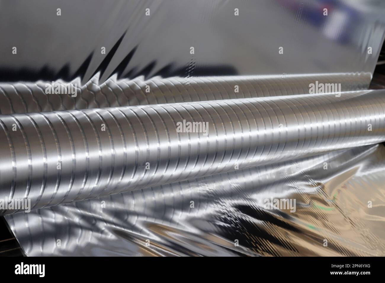 Four different roll of aluminum foil for food storage and cooking, isolated  image on white background. Foil rolls of different size: length and thickn  Stock Photo - Alamy