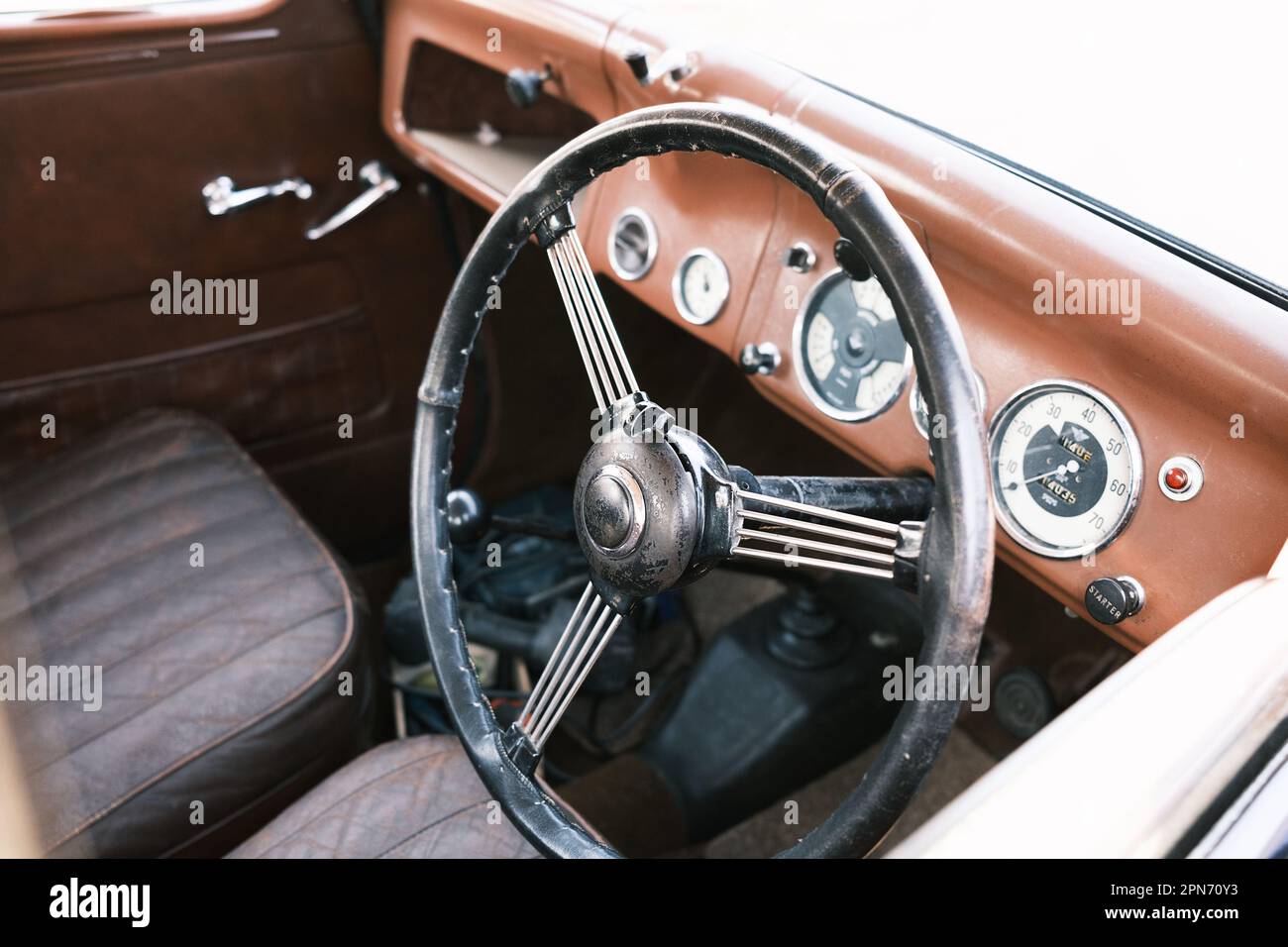 A classic car with its old steering wheel, control panel, and dashboard Stock Photo Alamy