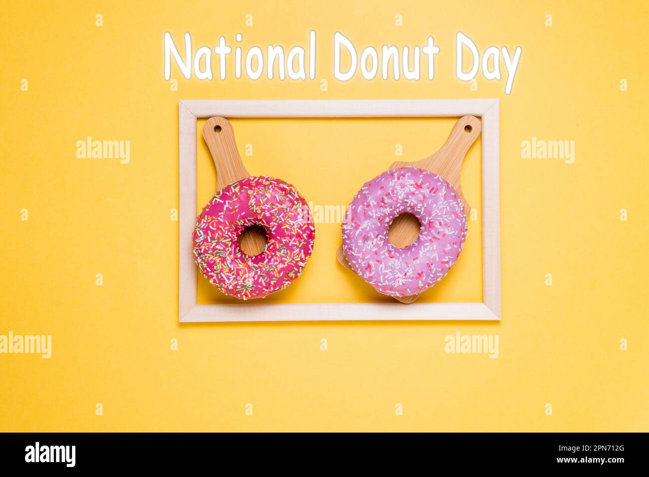 National Donut Day, donuts with pink icing on a yellow background