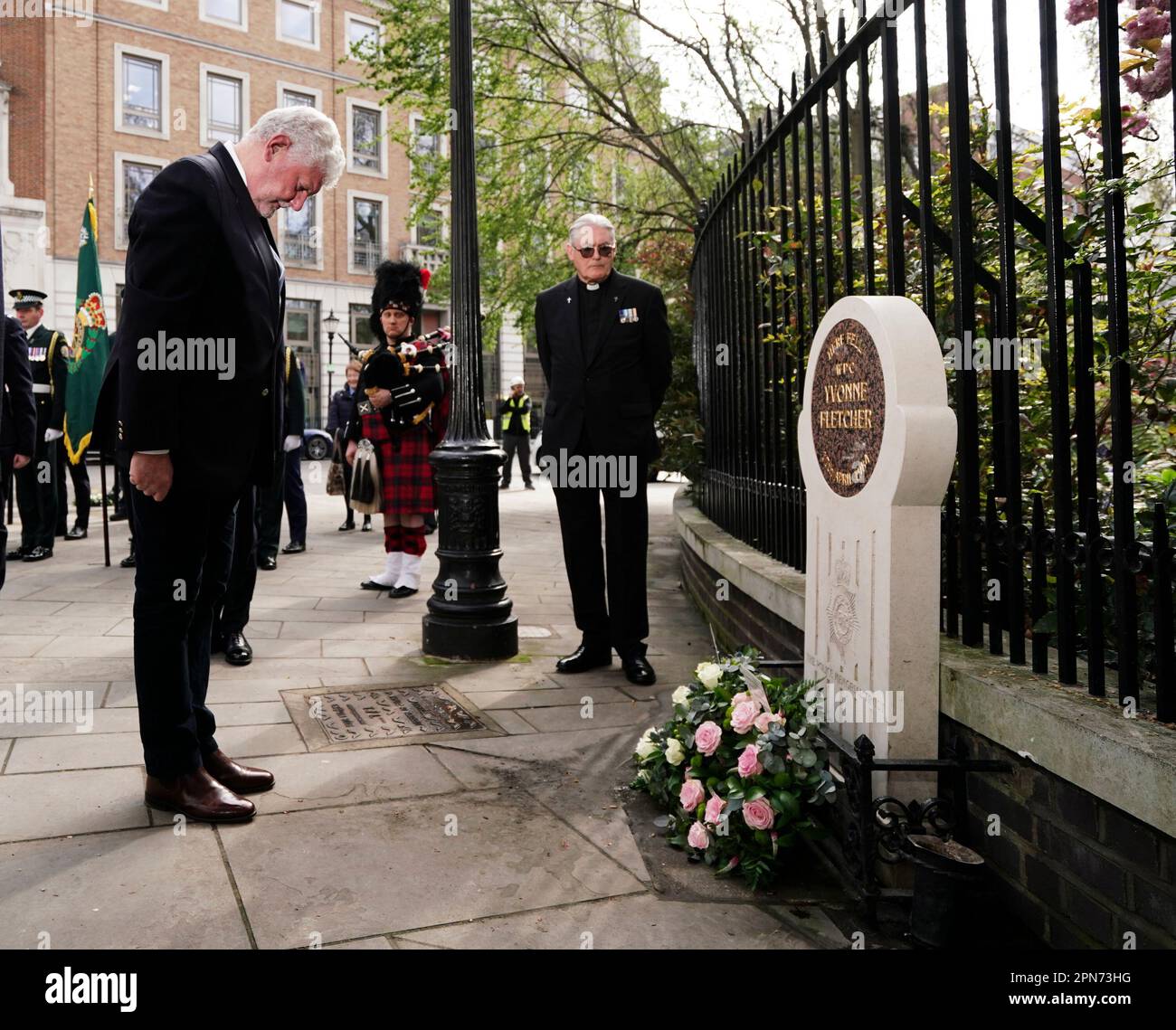 Lord Davis of Gower lays a wreath at a memorial service for WPC Yvonne