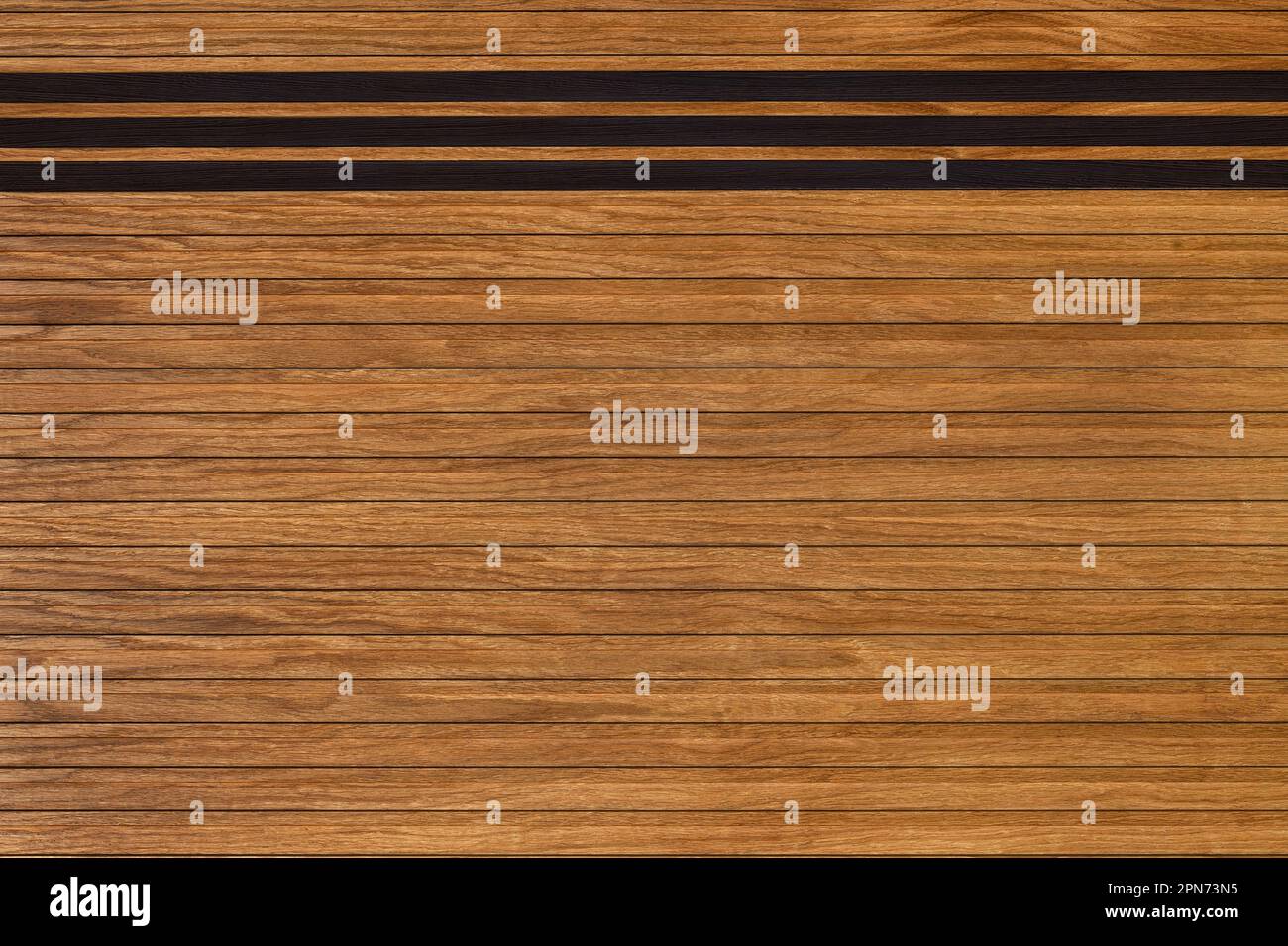 Texture and background of neatly horizontally laid wooden slats with pronounced dark linear planks. Stock Photo