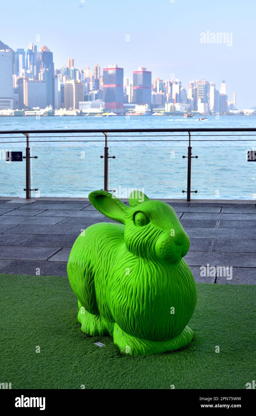 Green rabbit at waterfront with Hong Kong Island as backdrop Stock Photo