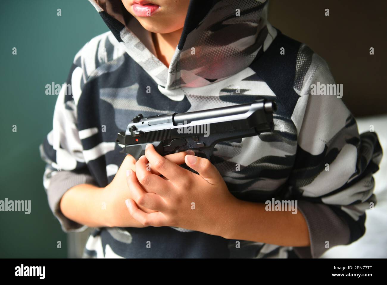 Child gun crime Stock Photo