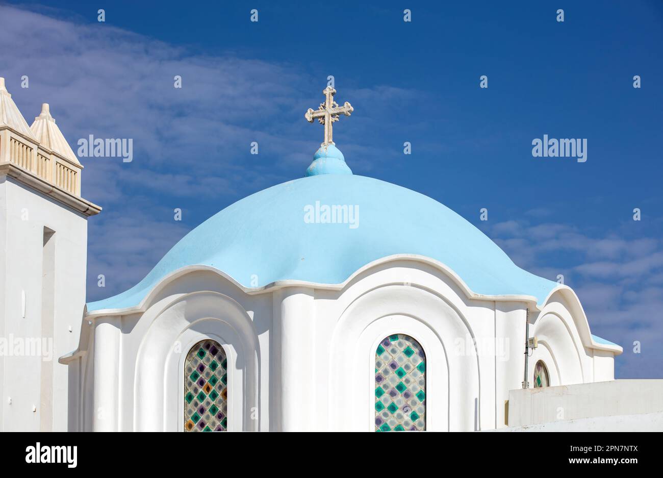 Panagia of Tinos island, Cyclades, Greece. Greek Orthodox Church dome roof, blue sky background