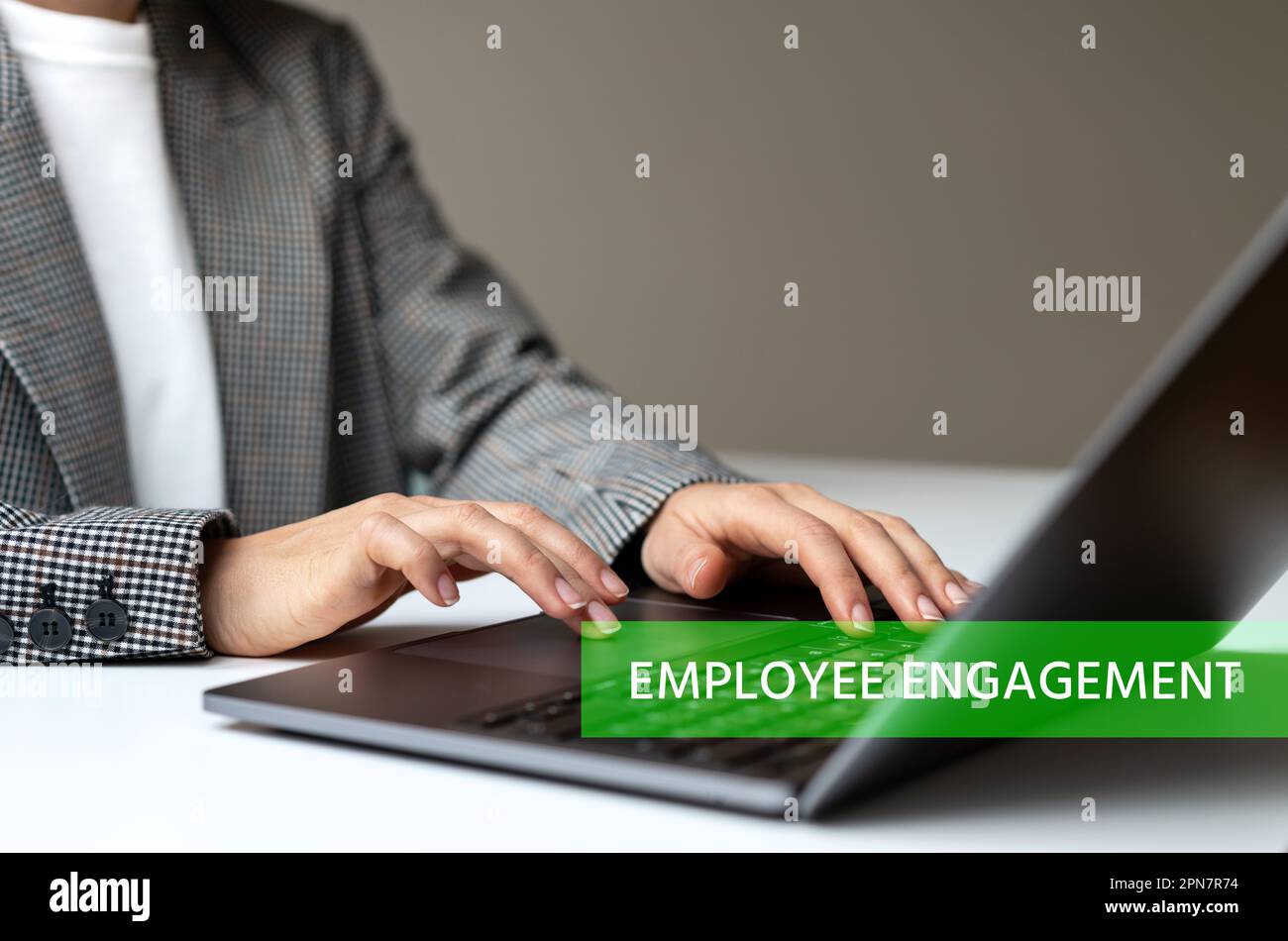 Human resource manager using laptop, text Employee Engagement. Stock Photo
