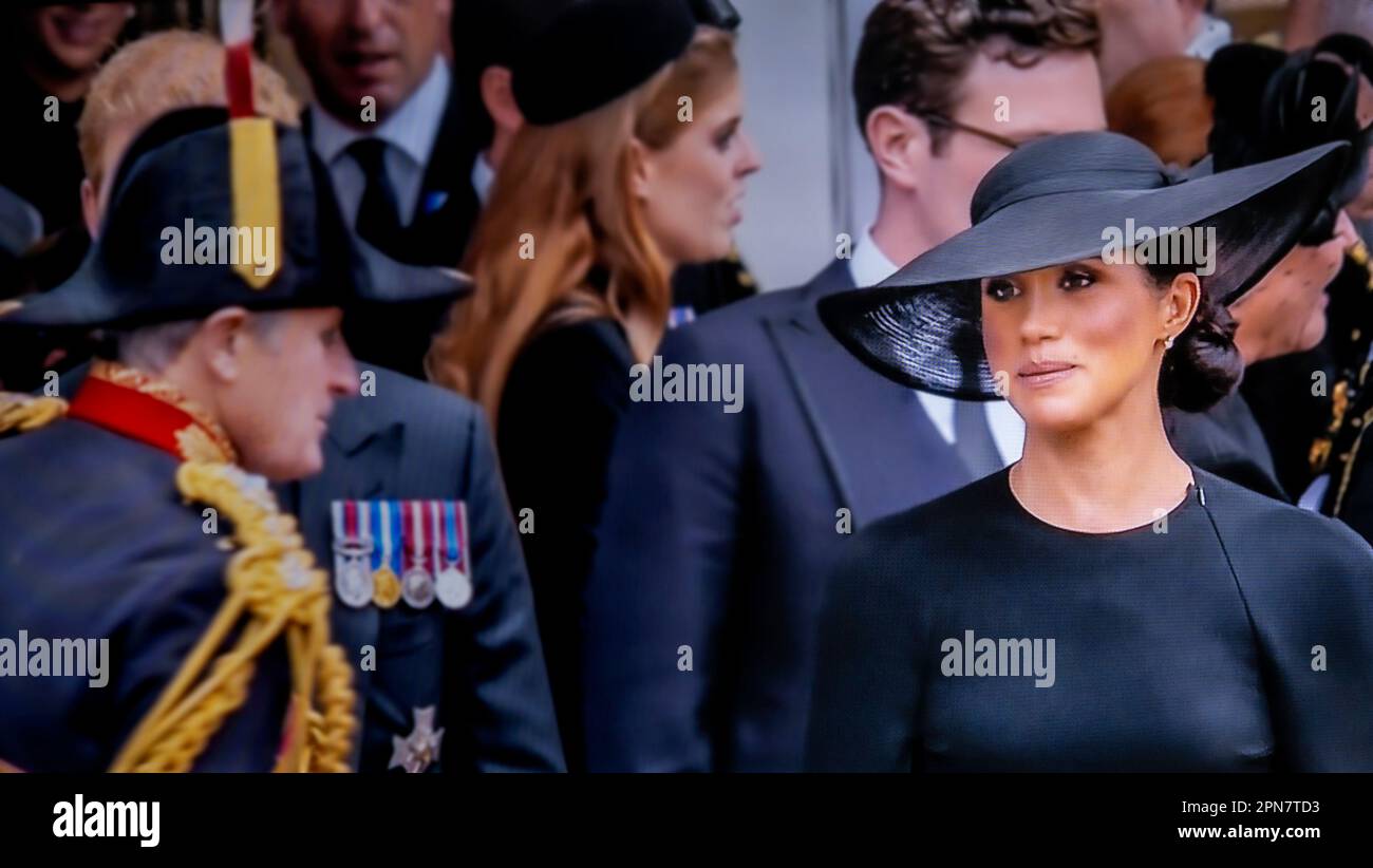 MEGHAN Duchess of Sussex pensive thoughtful at the funeral of Queen Elizabeth II departing St Georges Chapel Windsor Castle Berkshire UK Meghan Markle on the steps of the Windsor Royal Chapel  Windsor Castle Windsor Berkshire UK 19 Sep 2022 UHD broadcast still Stock Photo