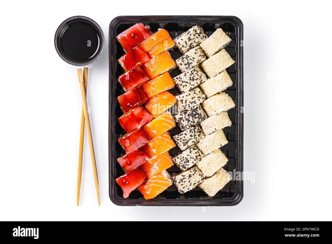 Sushi set with wasabi, ginger and soy sauce served in plastic box takeaway, to go. Assorted of