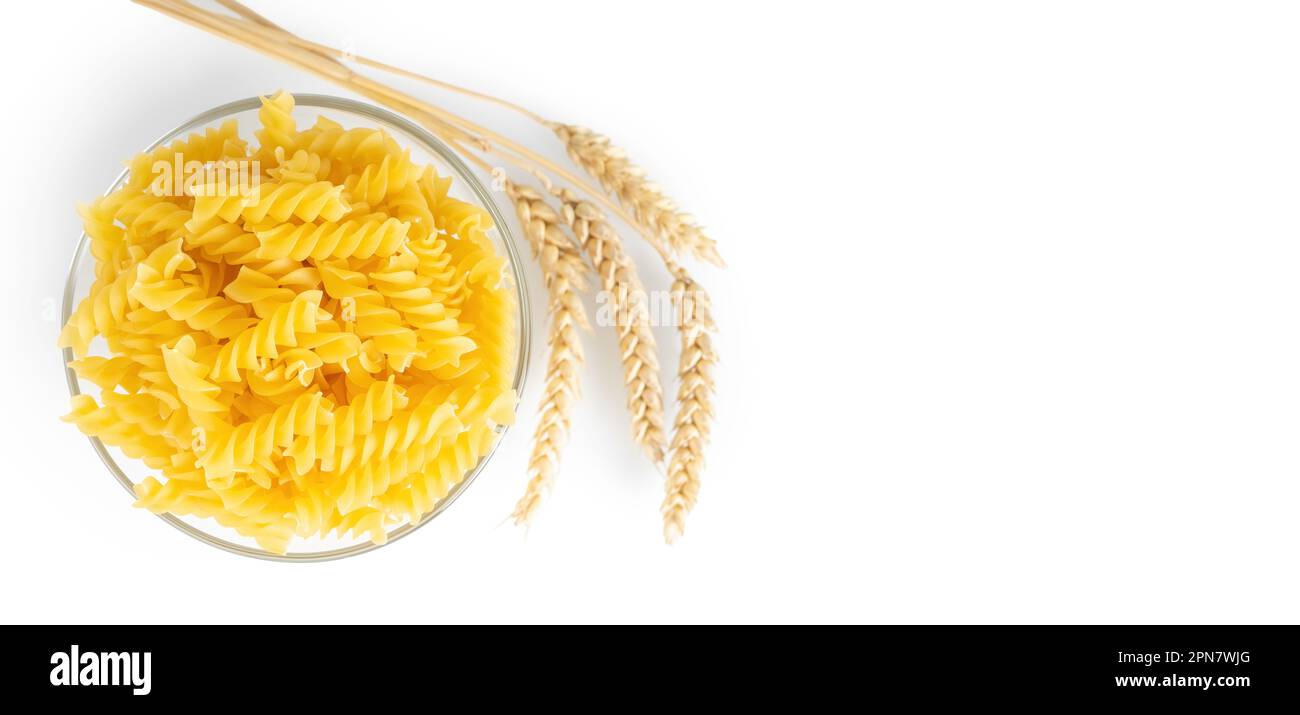 Pasta and wheat spikelets isolated on white background, banner, header ...
