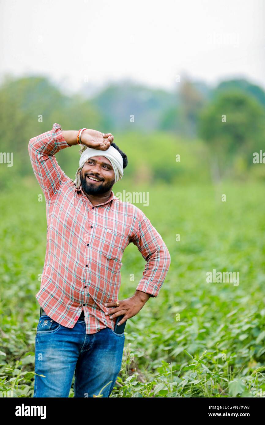 Happy Indian farmer, young farmer smiling in farm Stock Photo - Alamy