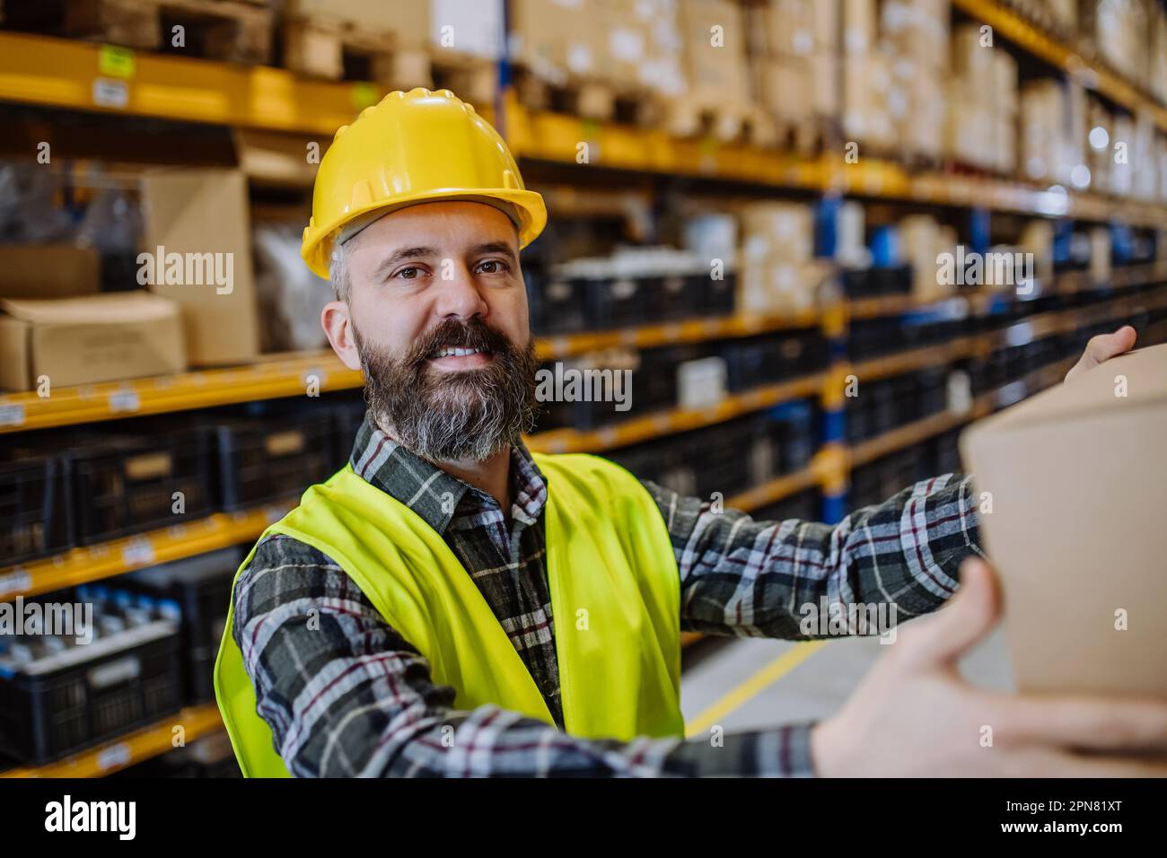 Warehouse worker stocking goods in a warehouse Stock Photo Alamy