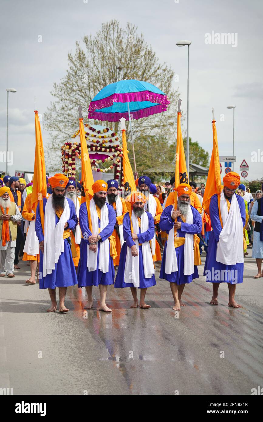 Nagar Kirtan procession, religious sikh event in the streets of the city. Marene, Italy - April 2023 Stock Photo