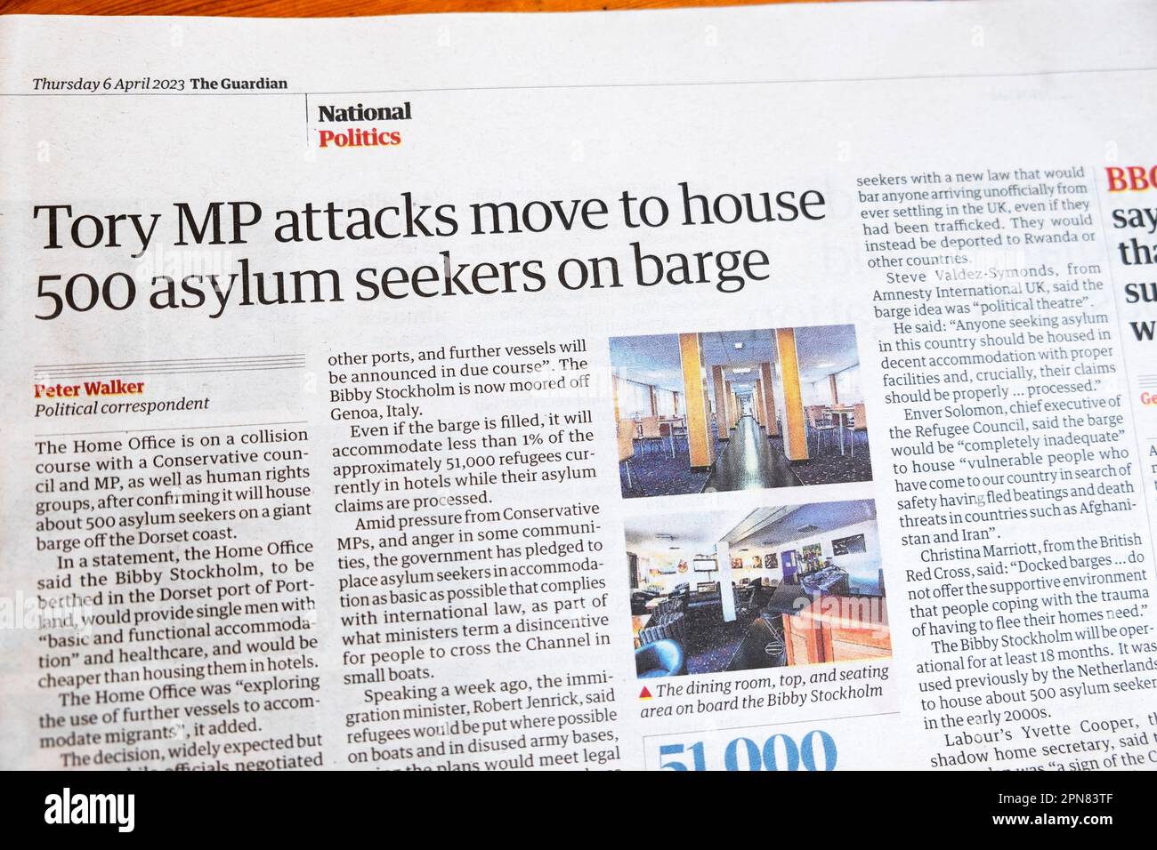 'Tory MP attacks move to house 500 asylum seekers on barge' Guardian newspaper headline human rights migrants article 6 April 2023 London UK Stock Photo