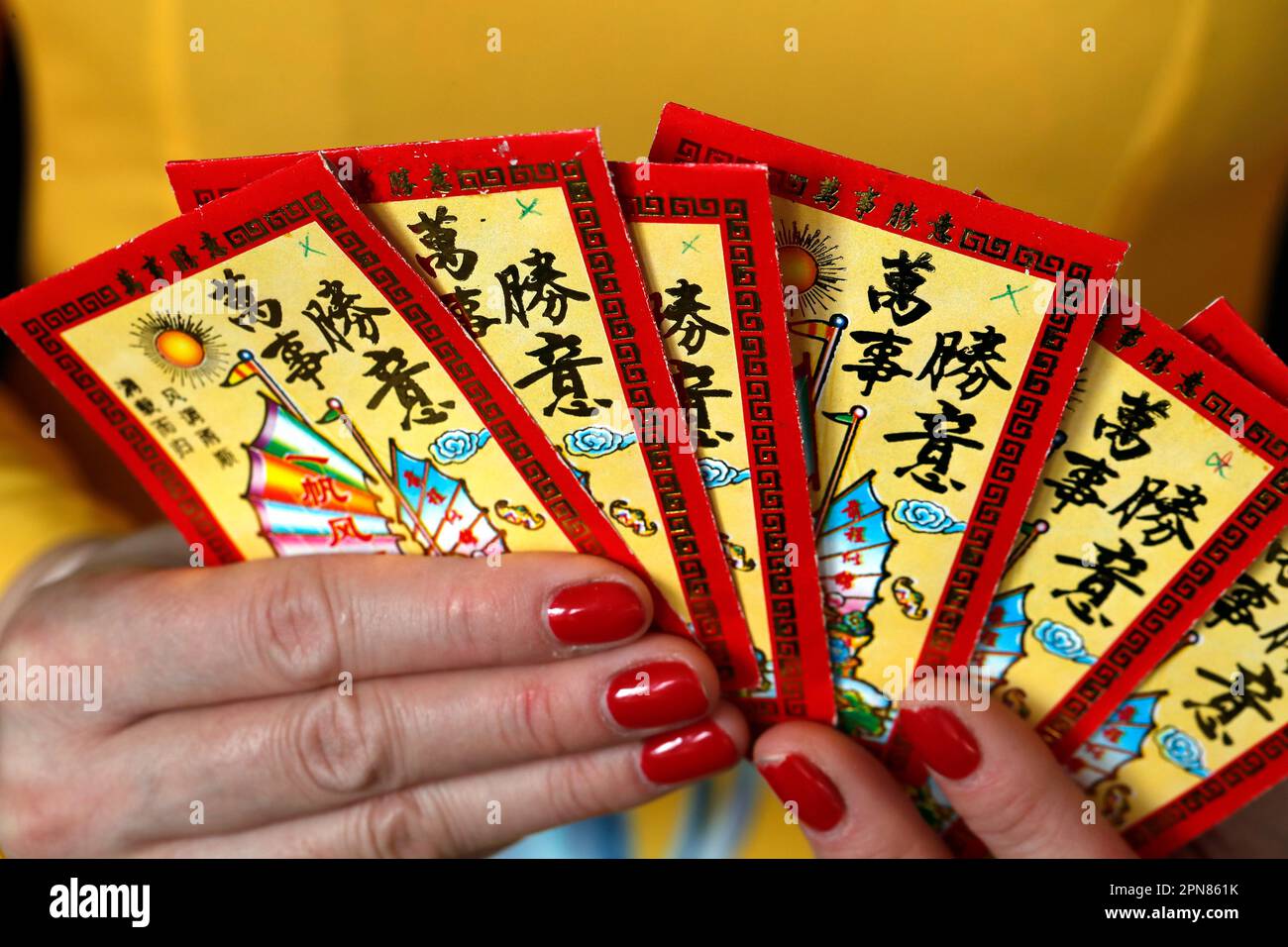 Asian woman with red envelopes ( hongbao ) for Chinese and Vietnamese New  Year celebration. Red color is a symbol of good luck. France Stock Photo -  Alamy