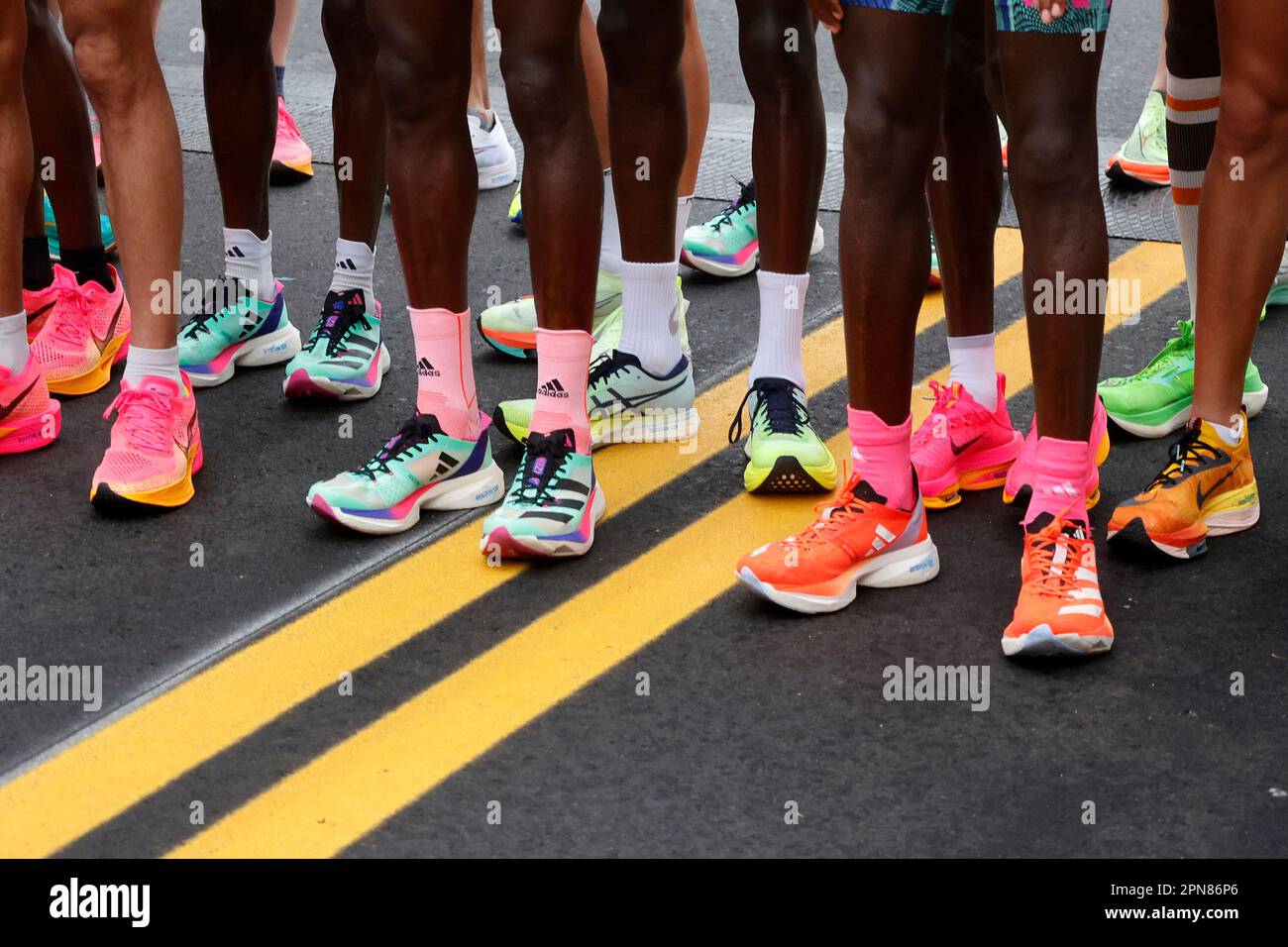 The footwear of the elite men is seen as they step up to the starting line during the 127th