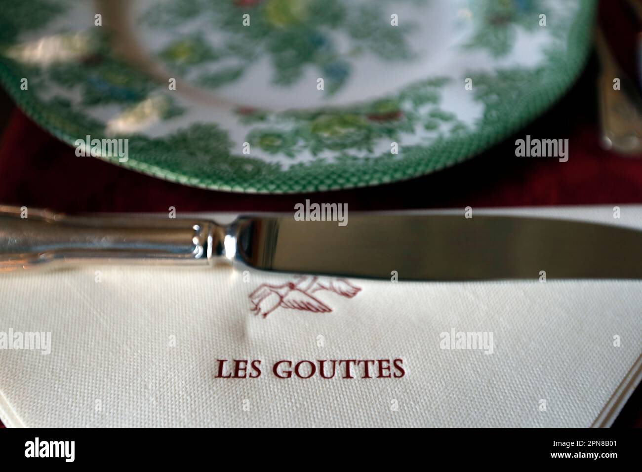 Single place table setting. Knife and napkin.    Burgundy. France. Stock Photo