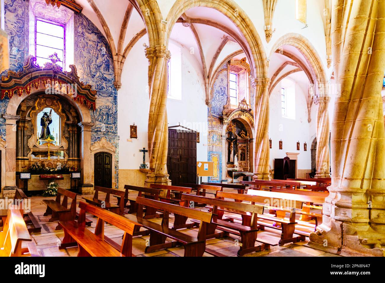 Partial view of the nave and chapels. The church of Santa María Magdalena in the square of the same name. Built in the Manueline style, which stems fr Stock Photo