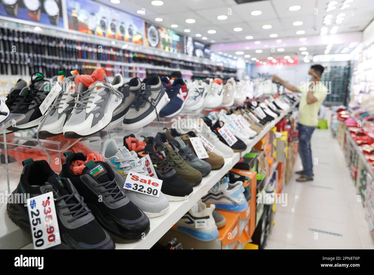 Shoes for sale in chinatown hi-res stock photography and images - Alamy