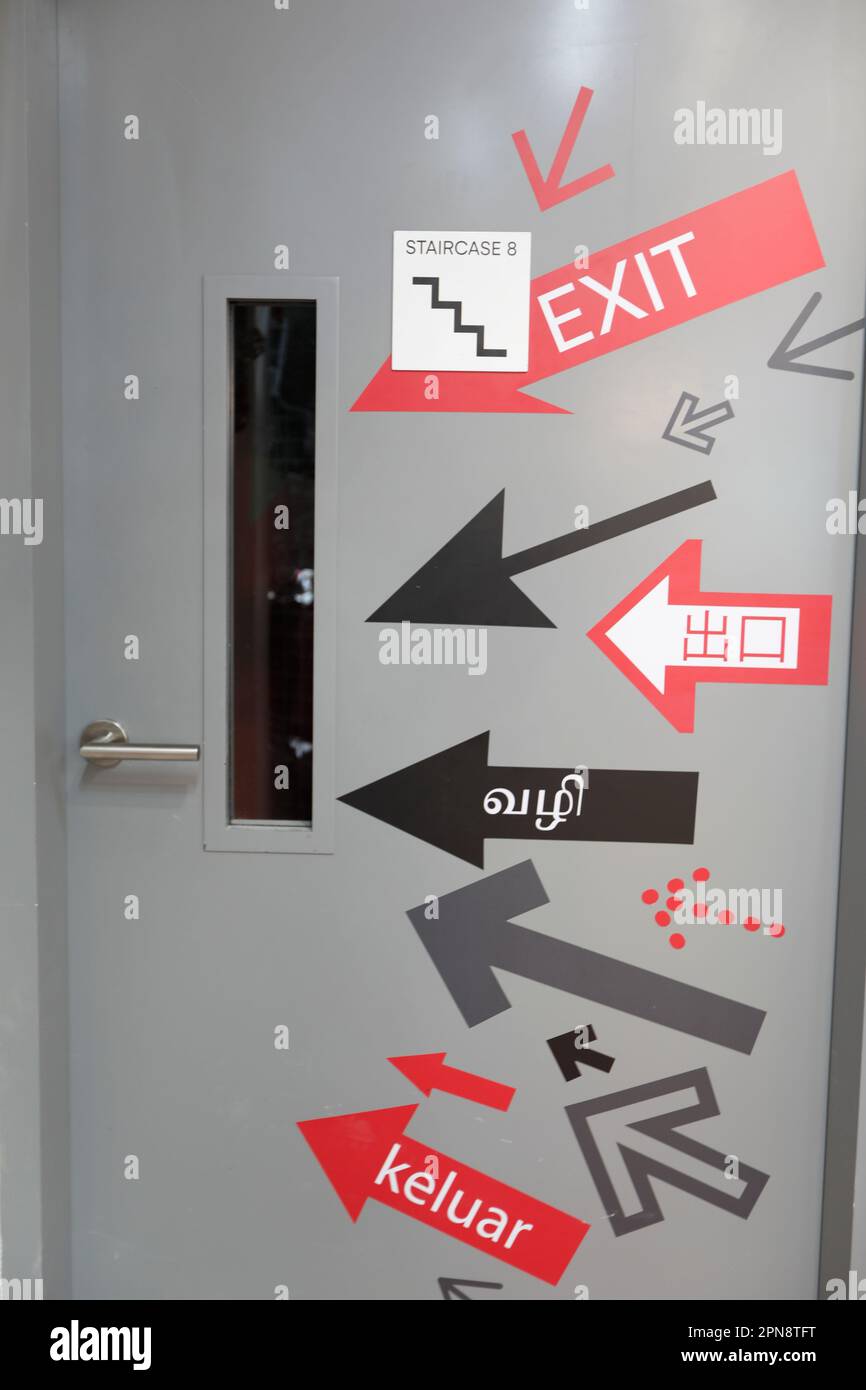 Exit signs door in a shopping center. Multi Language exit Sign