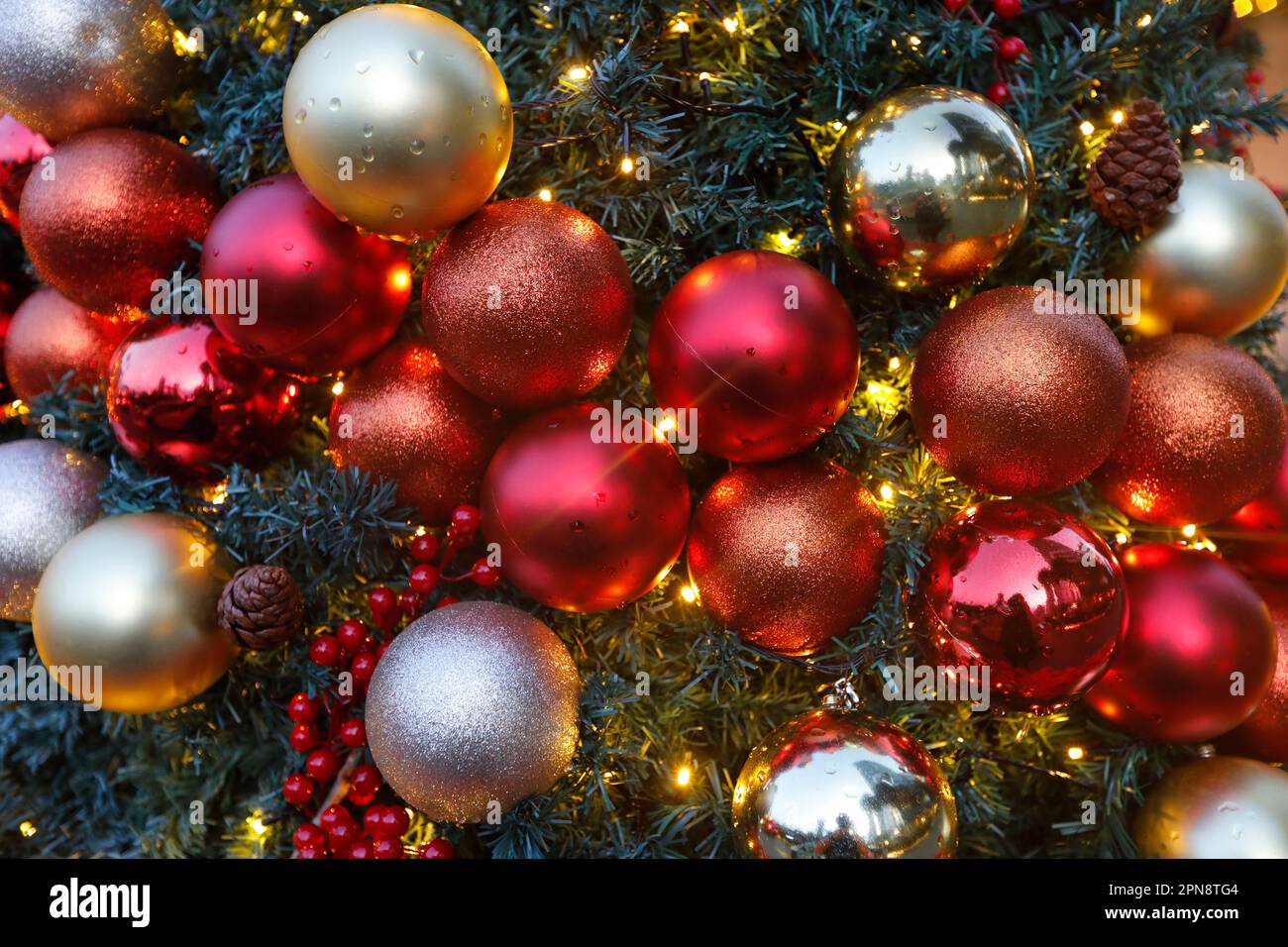 Selection of red and yellow Christmas balls for tree decoration.  Singapore. Stock Photo