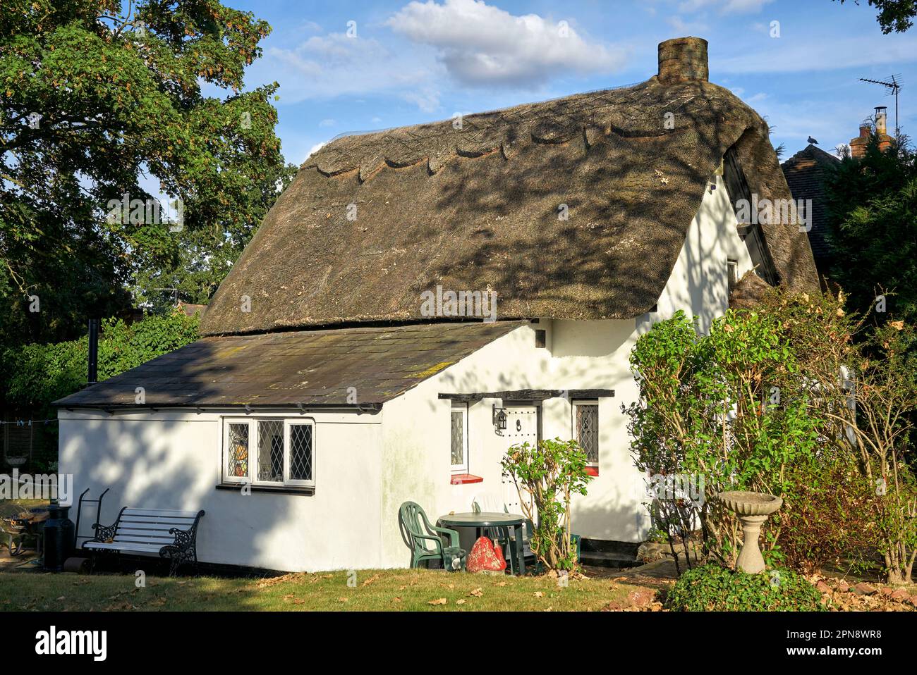 Thatched Cottage UK. Picturesque traditional thatched cottage exterior in an English rural setting. England UK Stock Photo