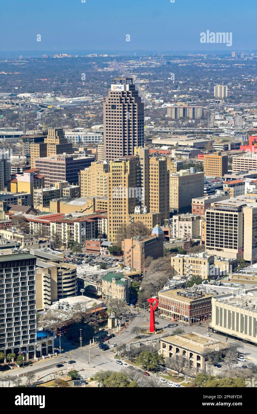 San Antonio, Texas, USA - February 2023: Aerial view of downtown San Antonio with the red Torch of Friendship sculpture in the foreground Stock Photo