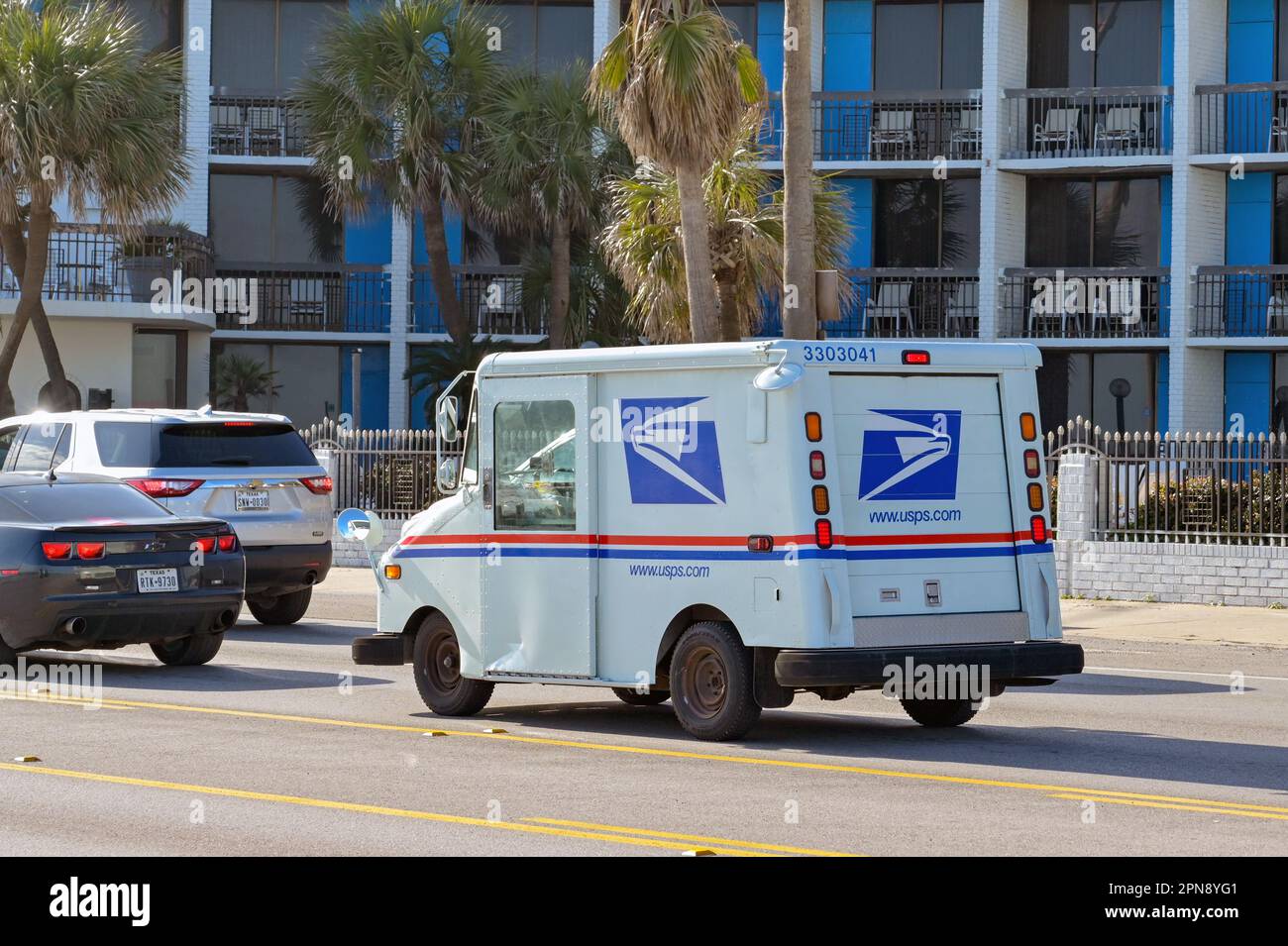 Galveston, Texas, USA - February 2023: Small truck used by the United States Postal Service driving on one of the city's streets. Stock Photo