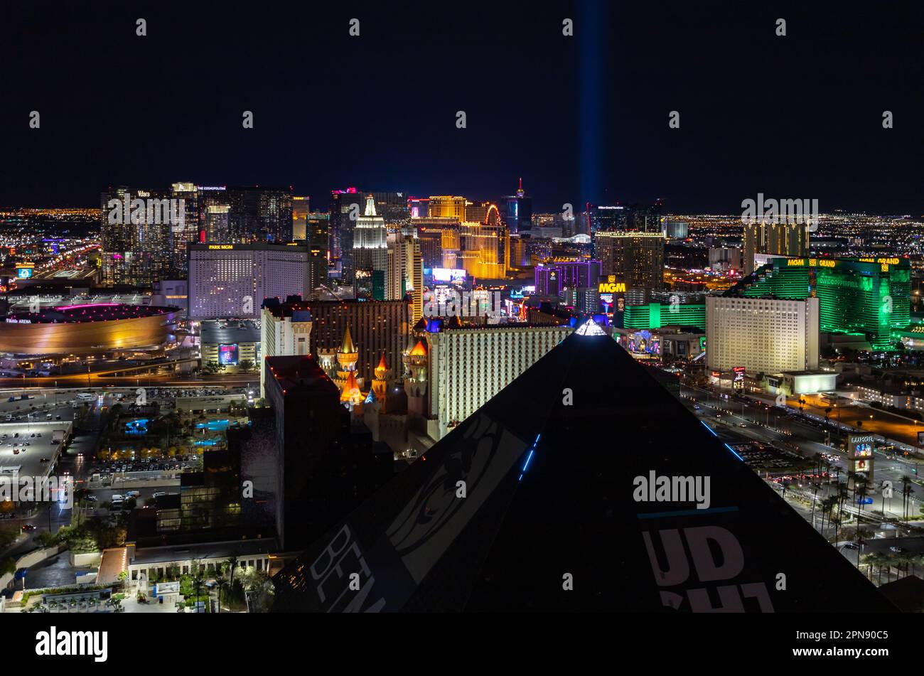 A picture of the Las Vegas Strip at night, with the top of the pyramid of the Luxor Hotel and Casino on the bottom. Stock Photo
