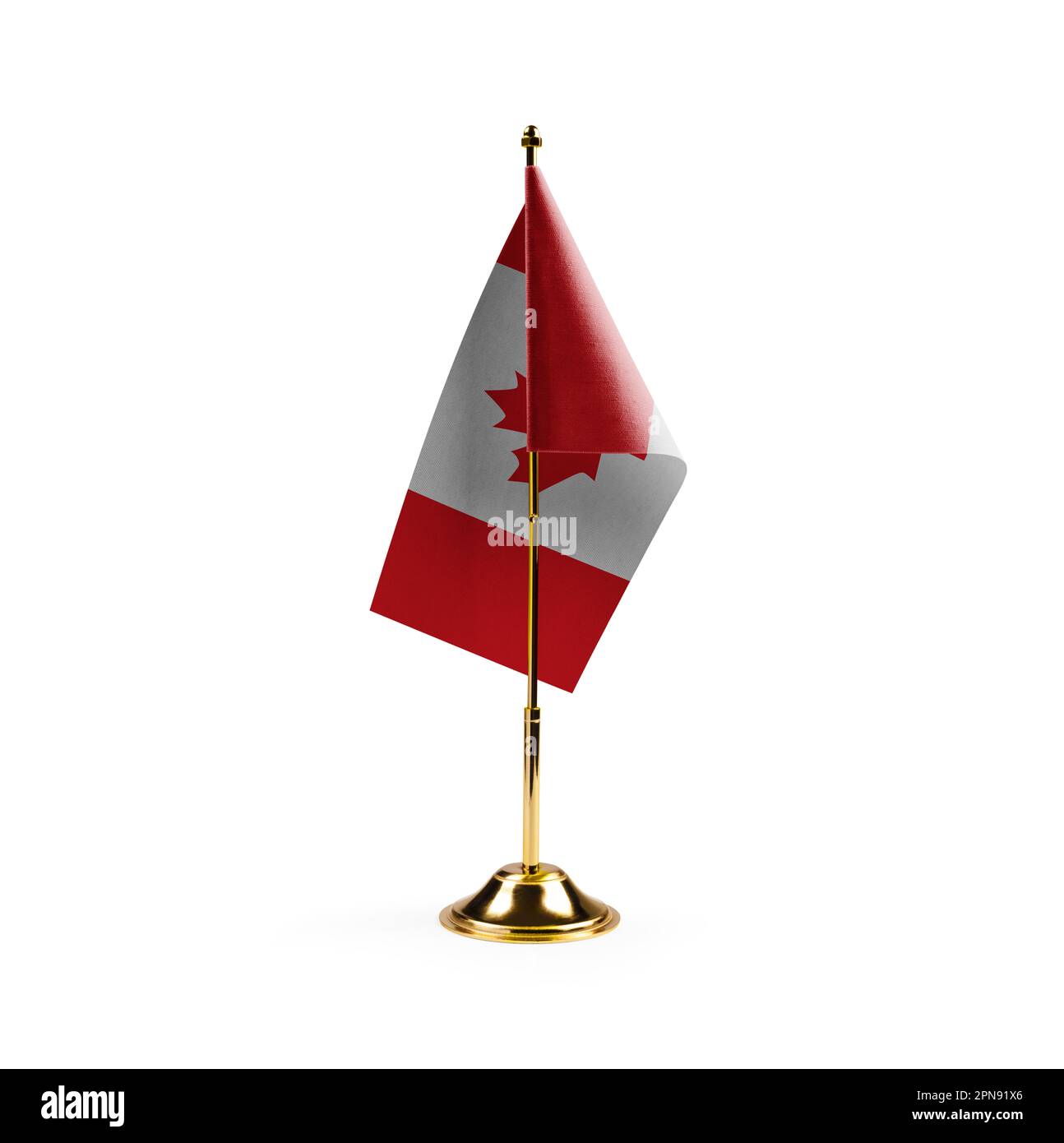 Small national flag of the Canada on a white background. Stock Photo