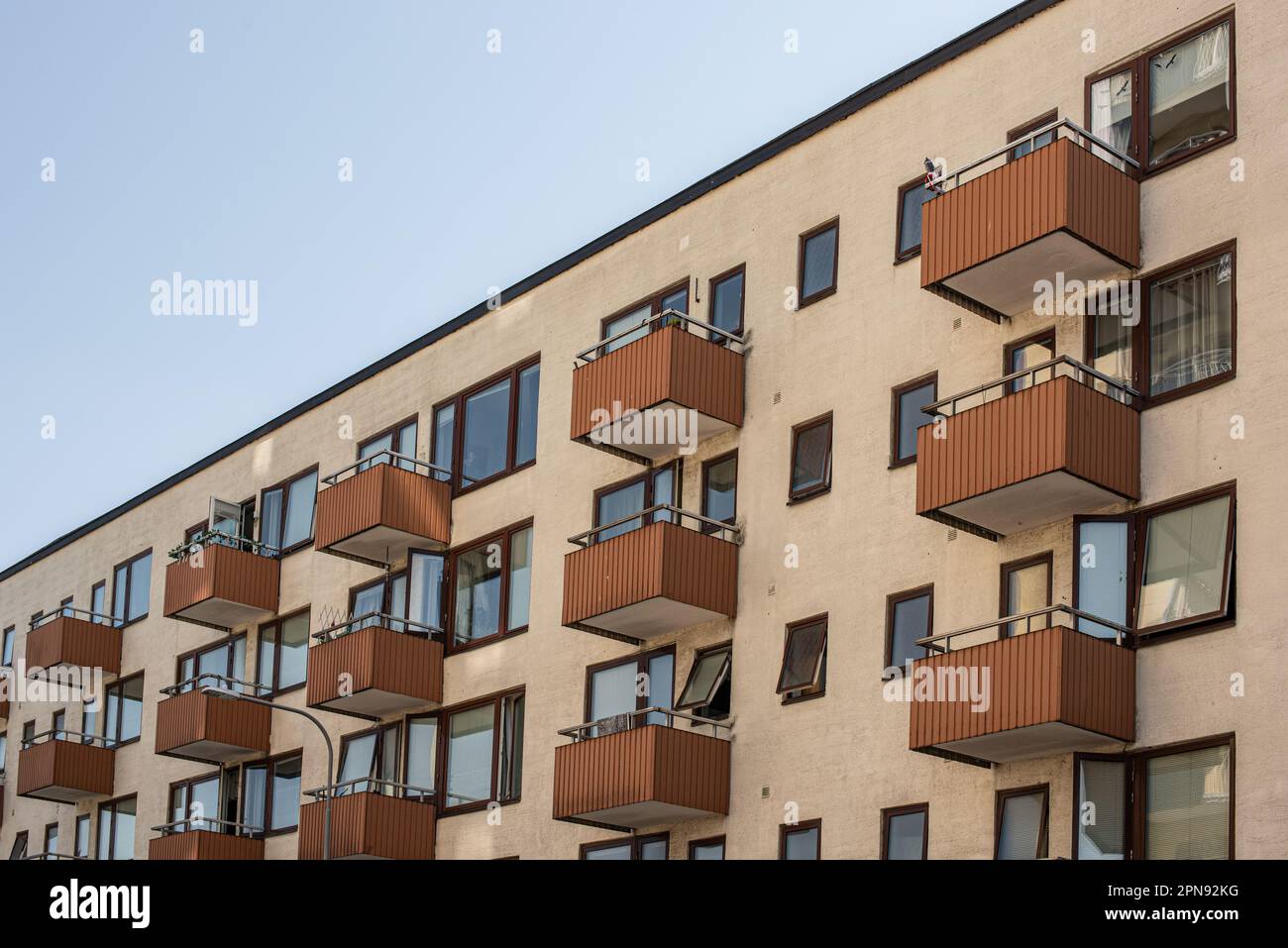 View of balconies on a multi storey apartment building Stock Photo - Alamy