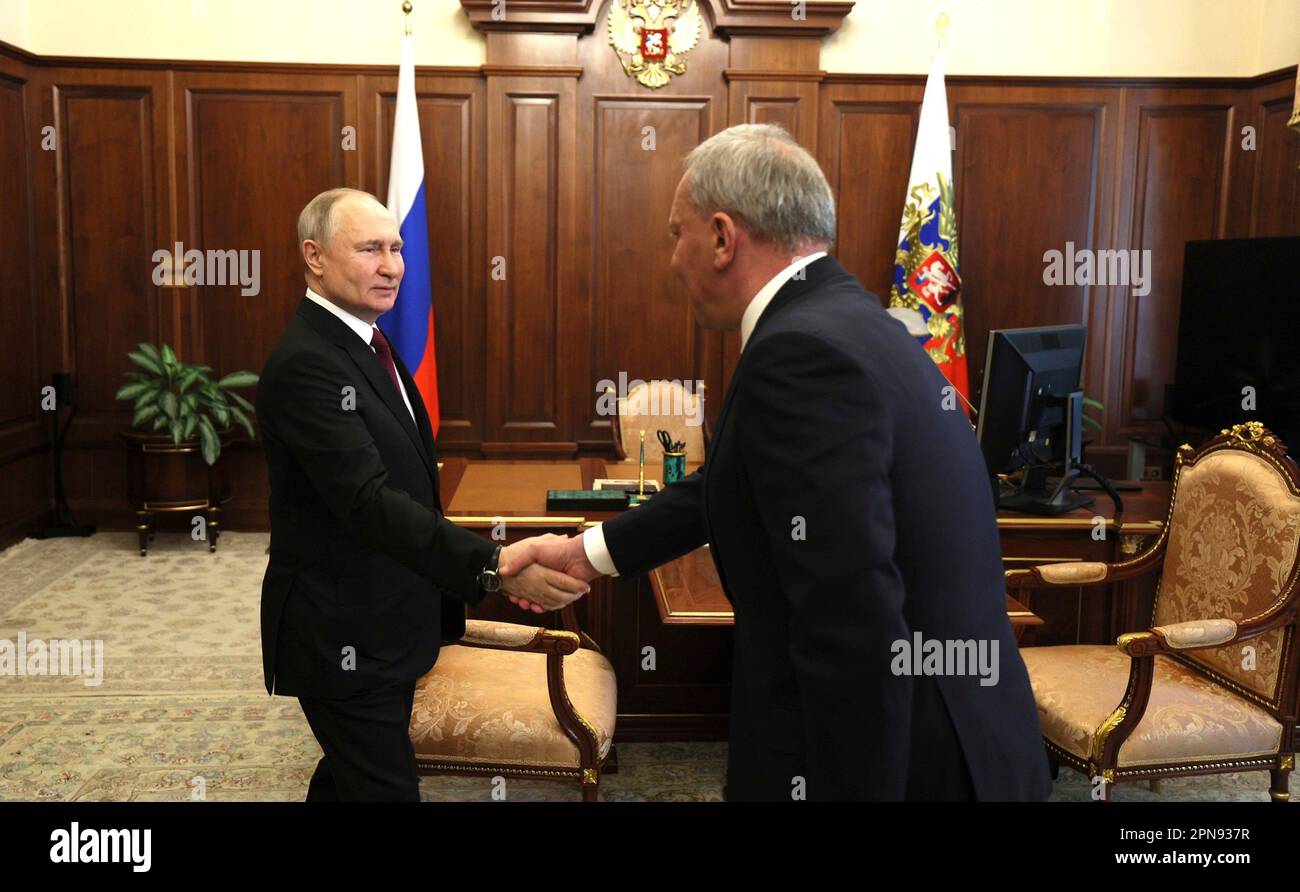 Moscow, Russia. 12 April, 2023. Russian President Vladimir Putin greets the CEO of the Russian Federal Space Agency Yuri Borisov, right, before a face-to-face meeting at the Kremlin, April 12, 2023 in Moscow, Russia.  Credit: Gavriil Grigorov/Kremlin Pool/Alamy Live News Stock Photo