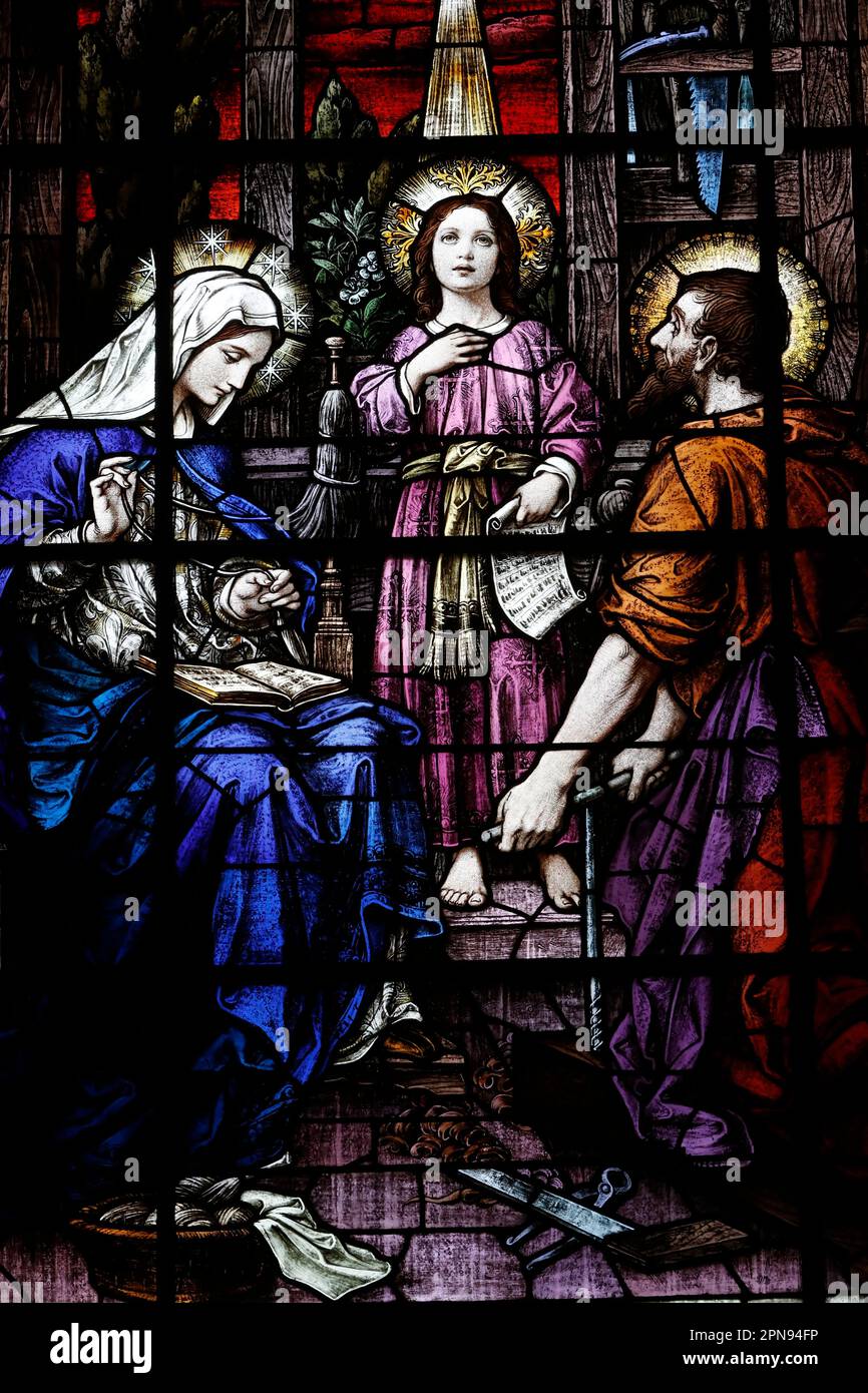 Stained Glass built 1920s. Glass by Franz Meyer Germany. Young Jesus,  Virgin Mary,  Joseph the carpenter. The Holy Family.   Gesu Catholic Church. Stock Photo