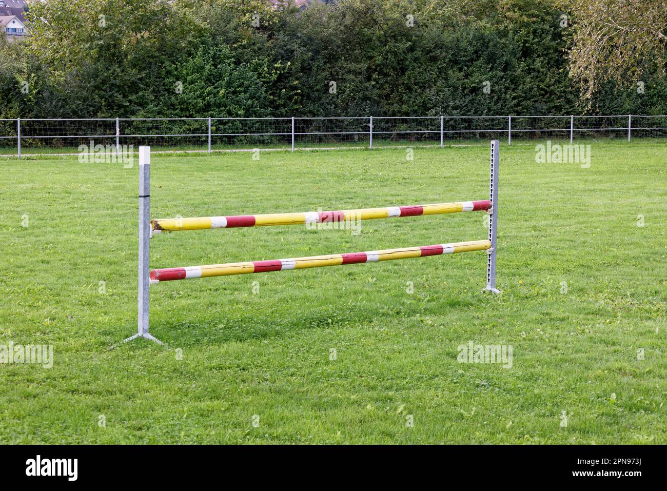 training ground for jumping horses with single yellowwhitered jumping