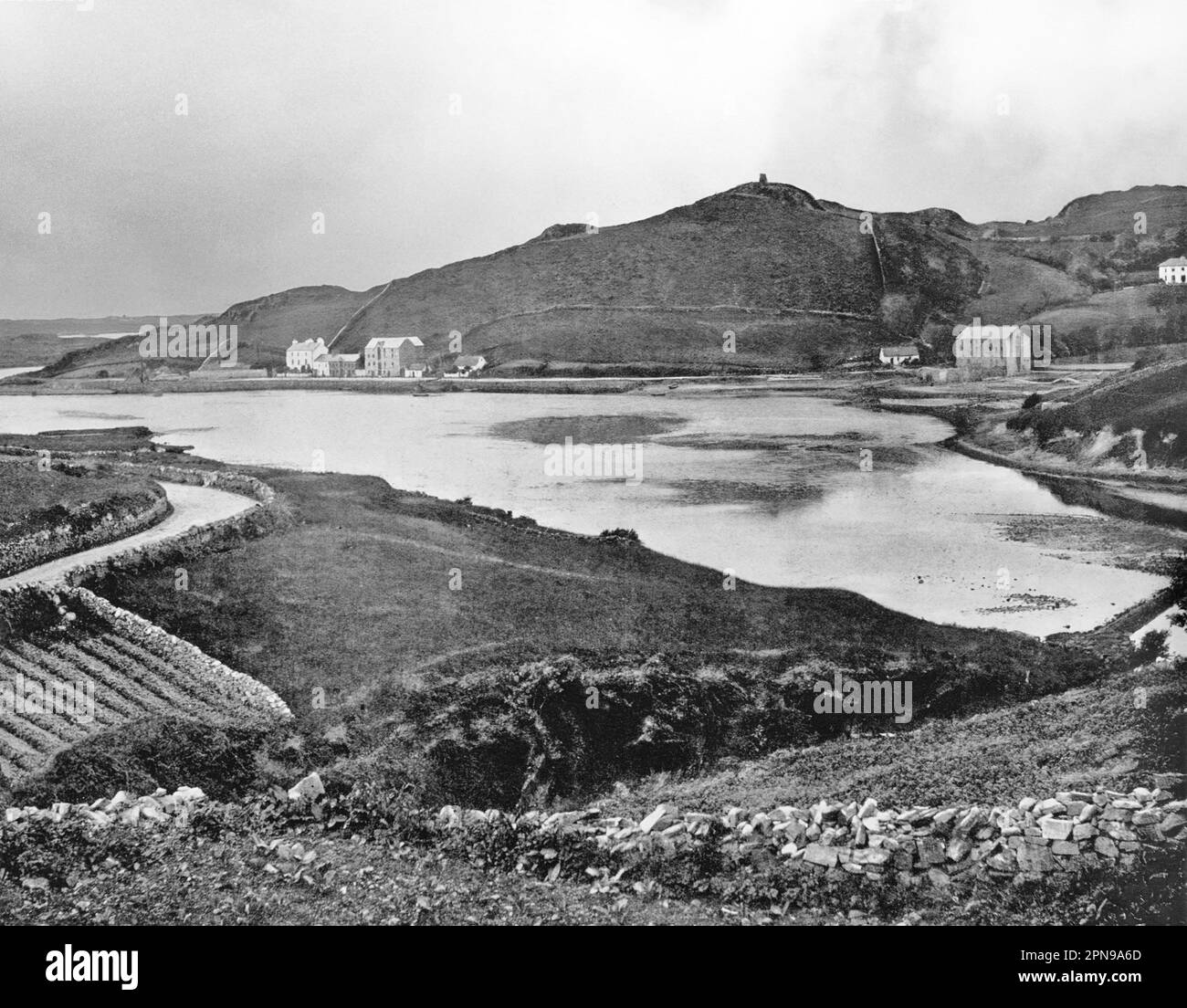 A late 19th century view of Clifden Harbour where the Owenglin River flows into Clifden Bay. A coastal town in County Galway, Ireland, it was founded at the start of the 19th century by John D'Arcy (1785–1839) who lived in Clifden Castle. Stock Photo