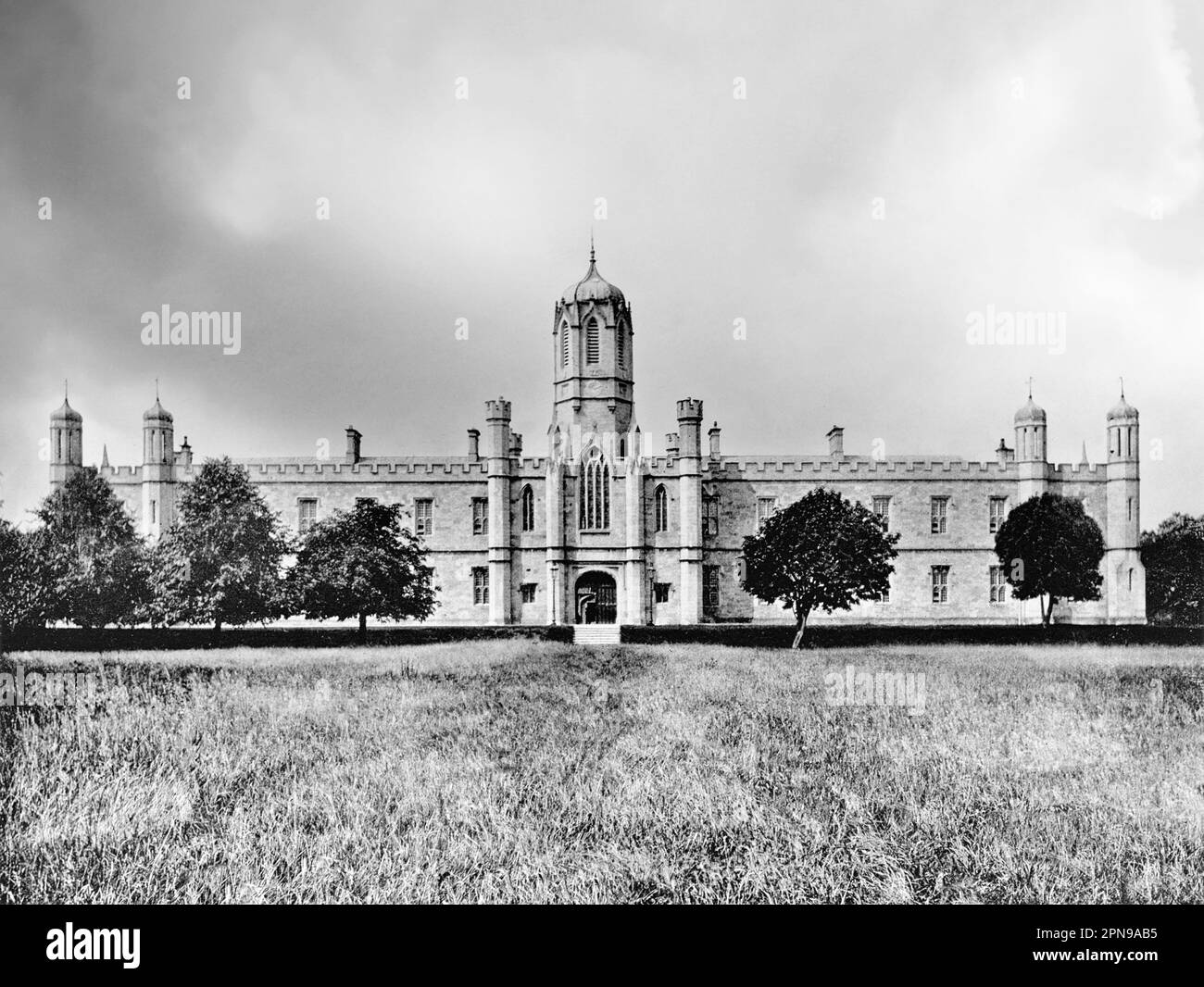 A late 19th century view of the Tudor-Gothic Queens College, Galway, Ireland. Designed by the architect J B Keane and completed in 1849, it's apparently a replica of Christ Church, one of the buildings on the campus  at the University of Oxford. Now just one of the buildings on the campus of University of Galway. Stock Photo