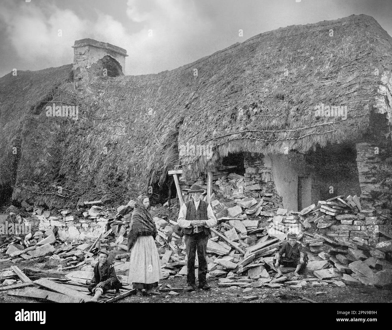 An eviction scene in County Clare in the mid-19th century.  The tenant-at-will occupants were turfed out by mostly Anglo-Irish landlords when they fell on hard times, often as a result of the Great Irish Famine. Stock Photo