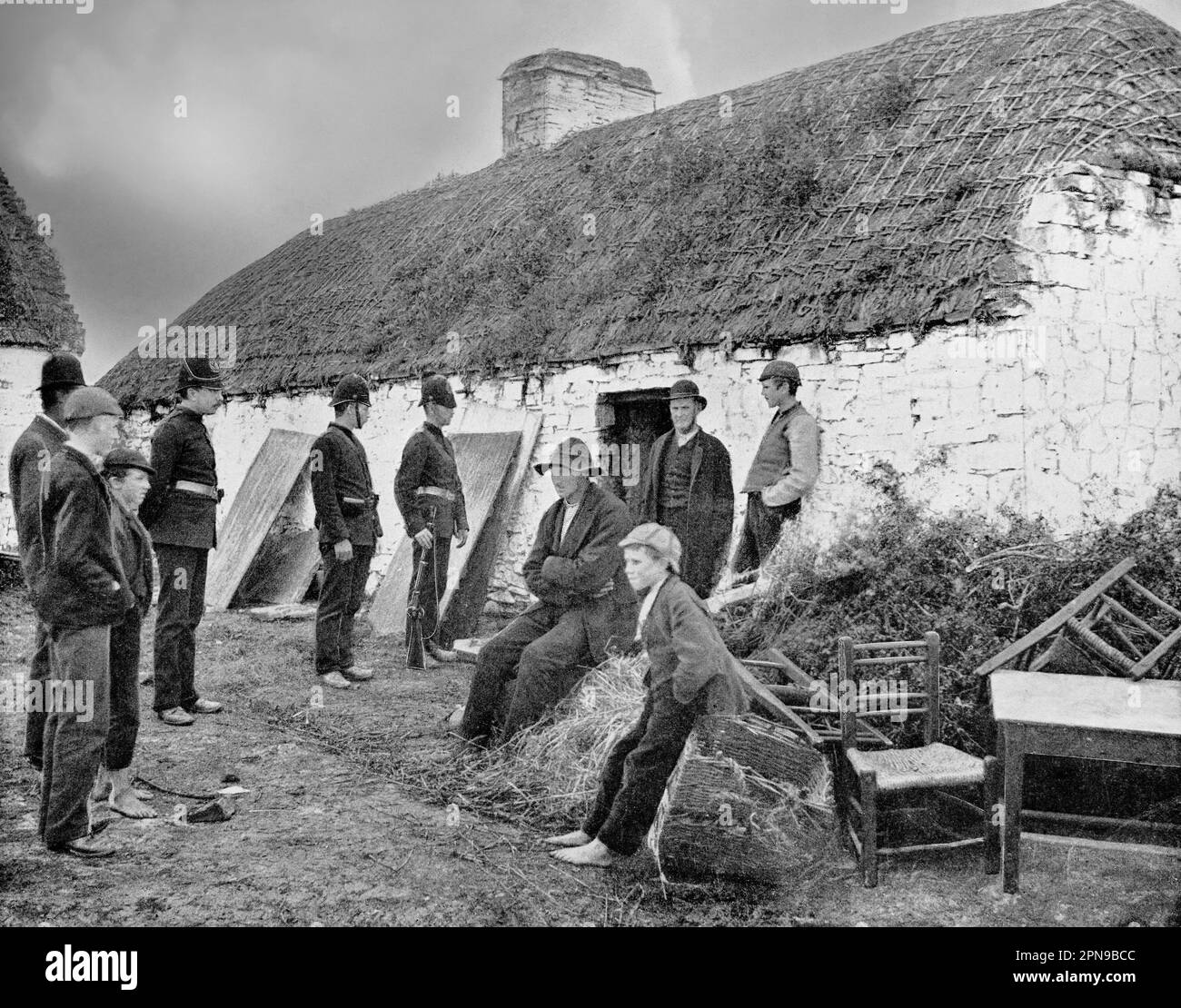 An eviction scene in Vandaluer, County Clare in the mid-19th century.  The tenant-at-will occupants were turfed out by mostly Anglo-Irish landlords when they fell on hard times, often as aresult of the Great Irish Famine . Stock Photo