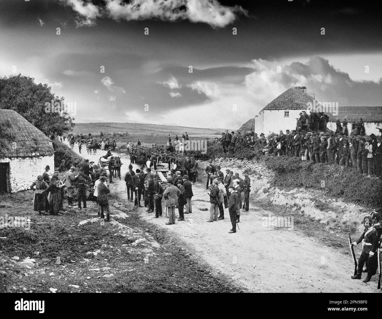 An eviction scene in County Clare in the mid-19th century.  The tenant-at-will occupants were turfed out by mostly Anglo-Irish landlords when they fell on hard times, often as a result of the Great Irish Famine . Stock Photo