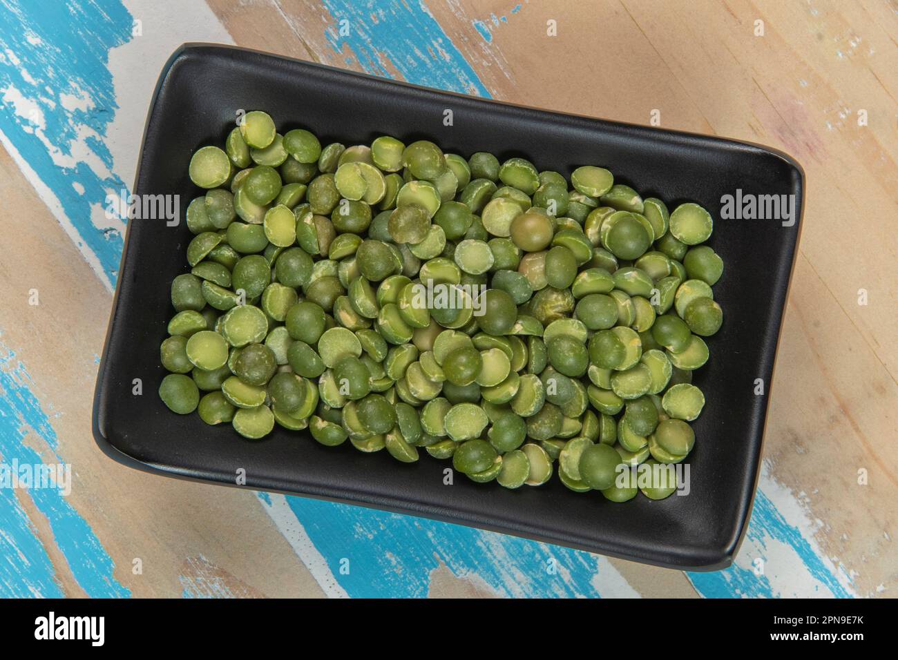 bowl with soy beans on blue rustic wooden table, Top  view Stock Photo