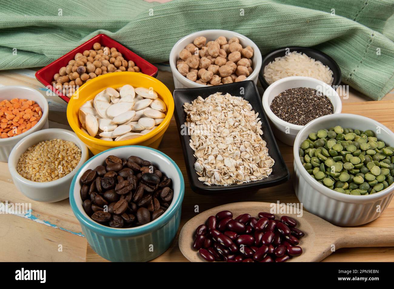 Different types of legumes in bowls, green and yellow peas, chickpeas ...