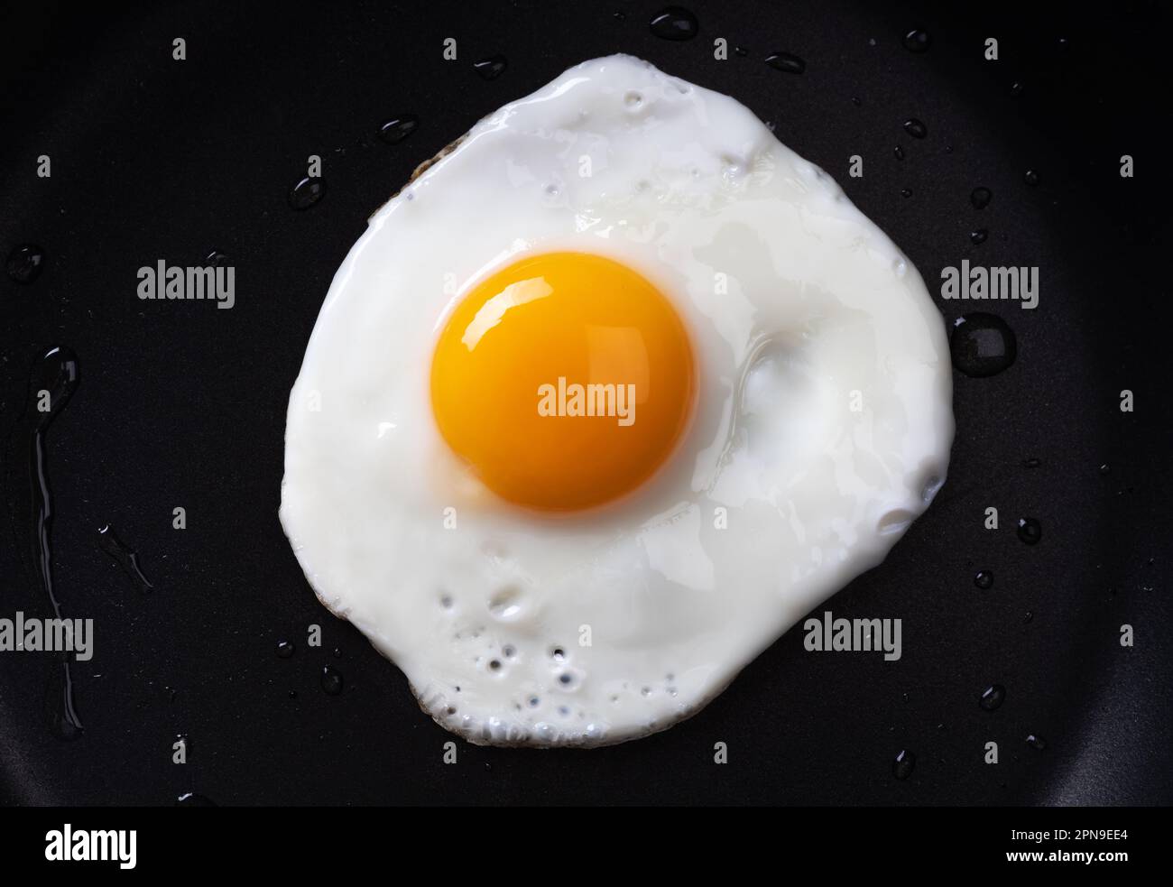 Fried egg in a frying pan. Stock Photo
