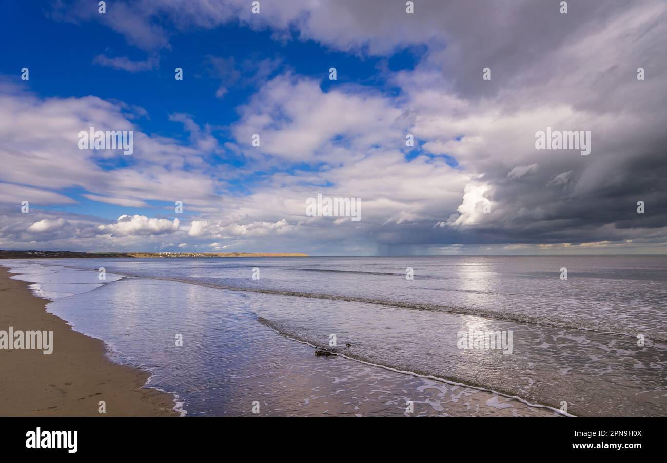 Sea level view of Filey Bay on the North Yorkshire Coast. Photo was taken near Reighton Sands looking across the bay towards Filey. A recent rain stor Stock Photo