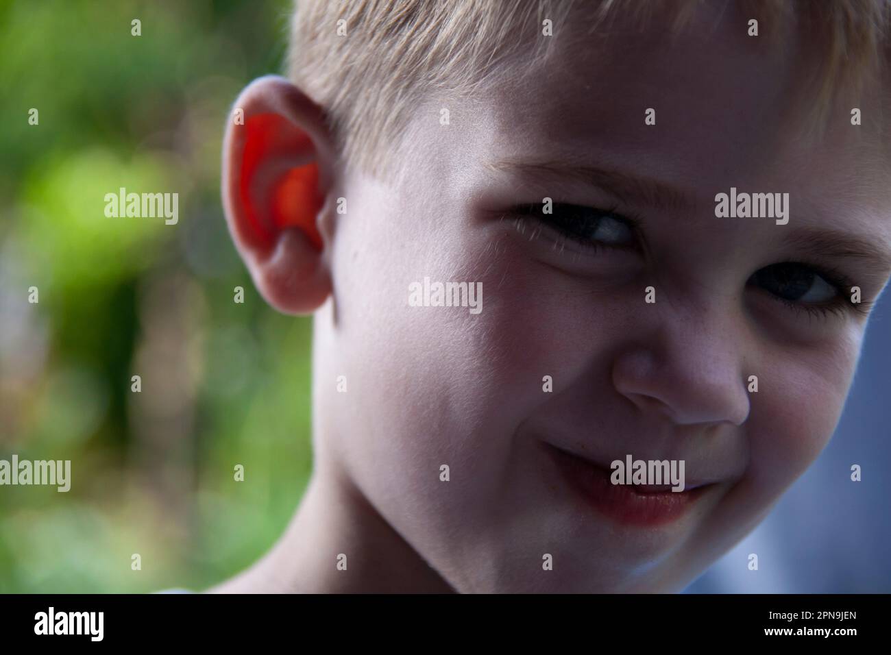 Close-up portrait of young boy smiling Stock Photo