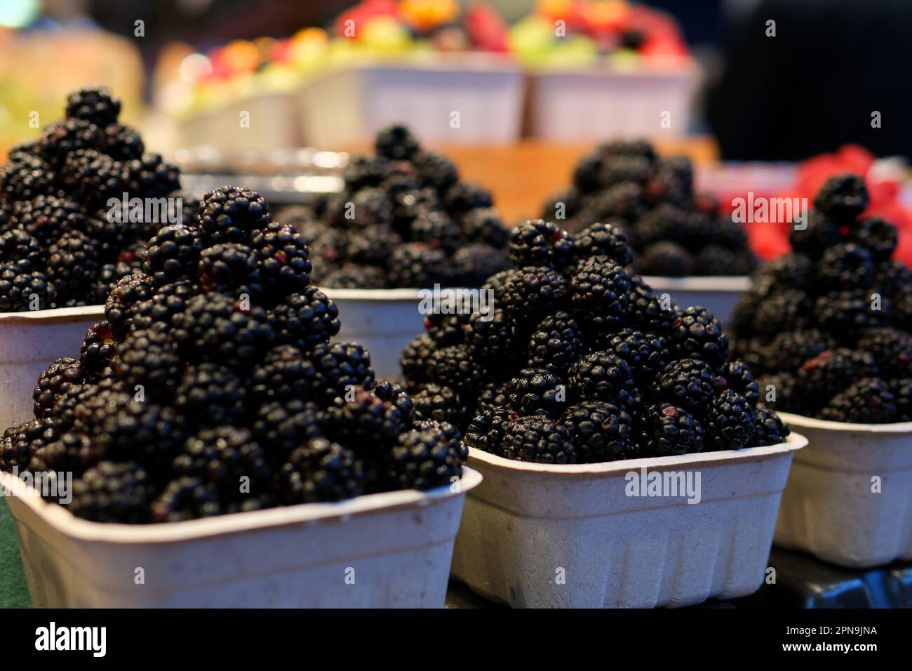 strawberry raspberries and blackberries on the market in containers ...