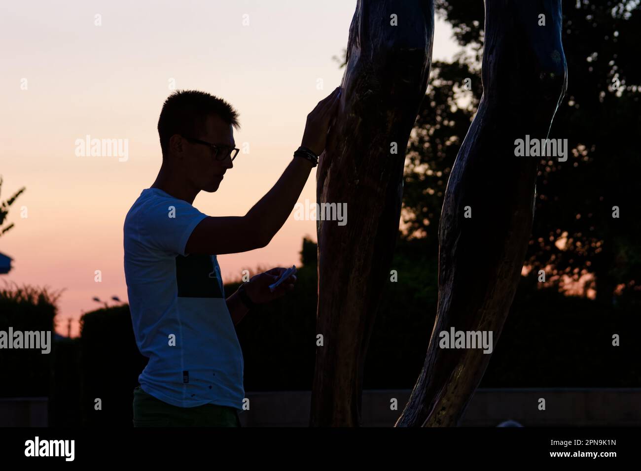 People venerating the statue of the Risen Christ in Medjugorje. The