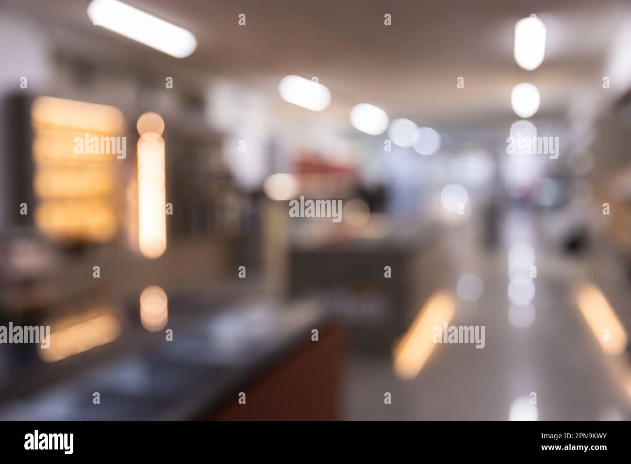 A blurry unfocused shot from store or office with bokeh background for head shot or business portrait Stock Photo