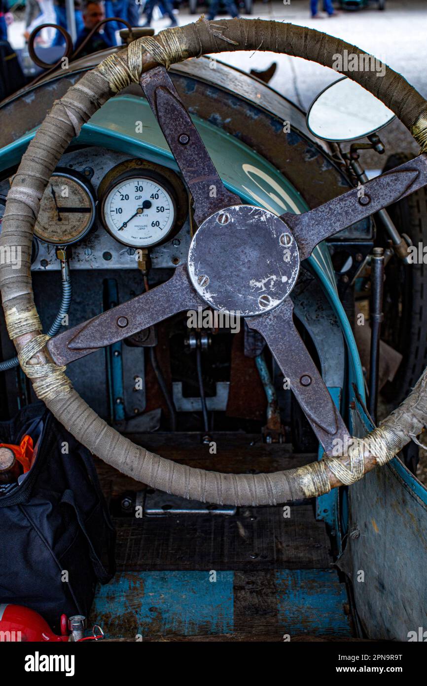 Steering wheel and dashboard of a pre war car at  Members' Meeting at Goodwood Motor Circuit in West Sussex,United Kingdom. Stock Photo