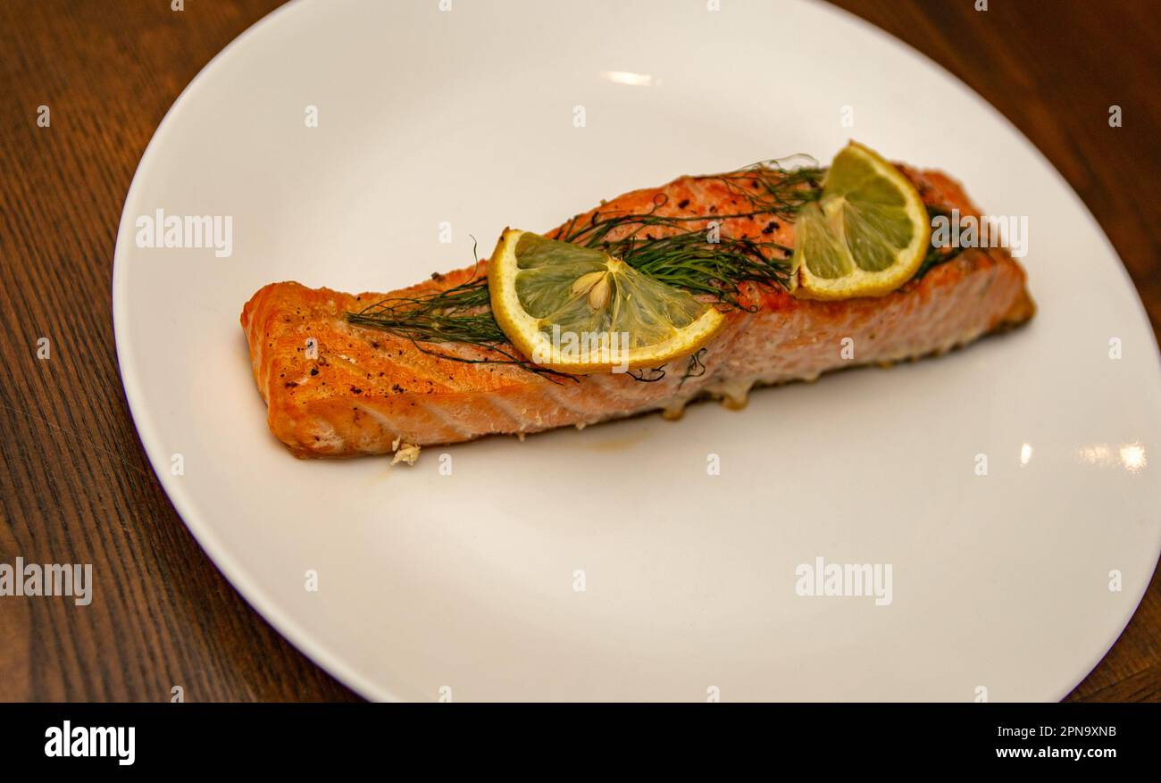 Grilled Salmon Dinner with Dill and Lemon Slice Stock Photo - Alamy